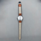 HONGLIAN 32mm brown leather band manual watch with 17 jewels and Roman numeral dial.