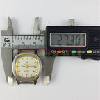 24mm SHANGHAI JINJI lady watch with golden nail markers and square case, manual mechanical movement visible.