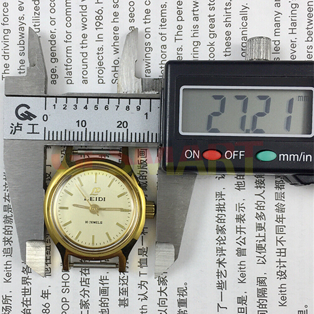 Leidi 27mm steel manual watch with 18 jewels, golden dial, and matching band for elegant wear.