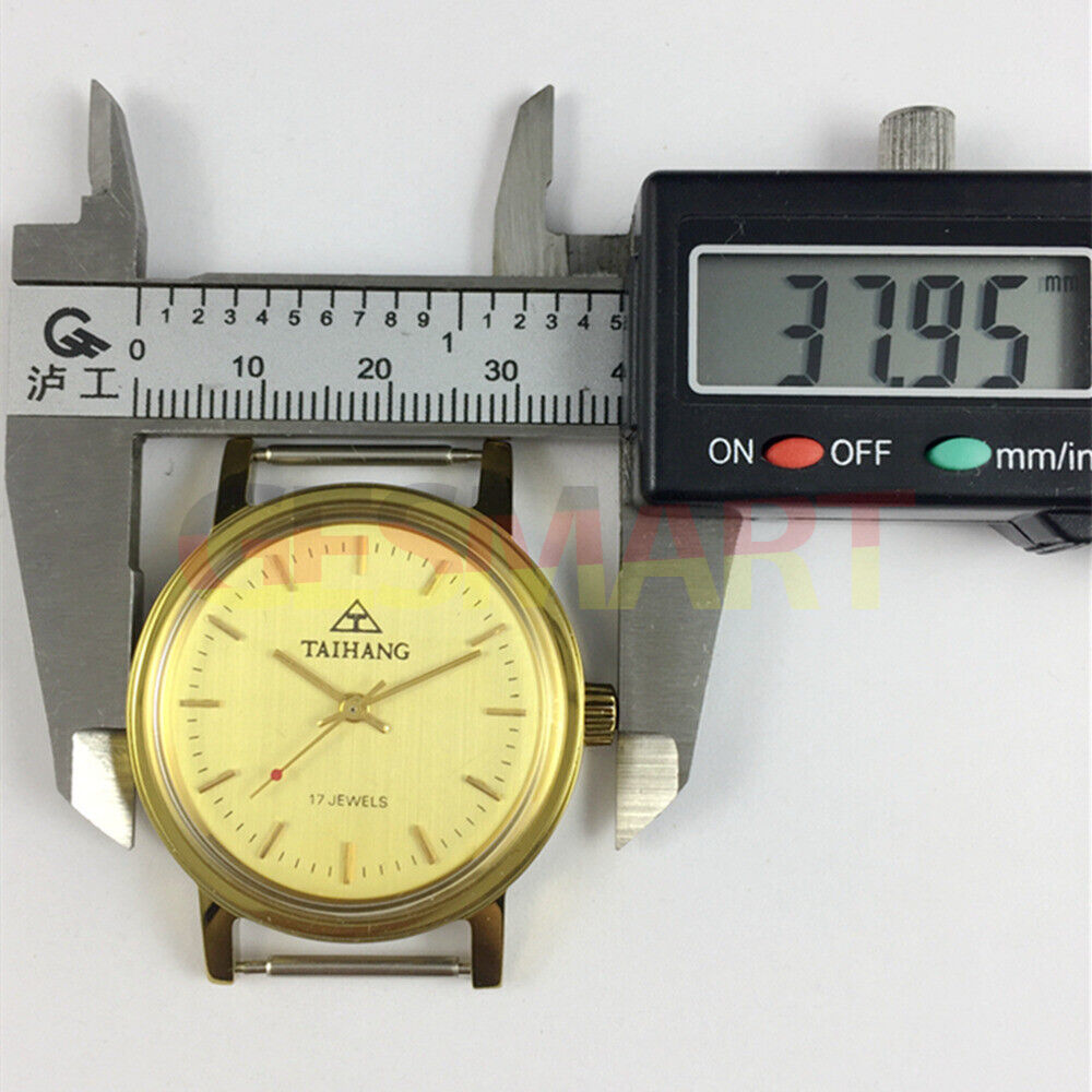 37mm TAIHANG manual watch with gold case, yellow dial, and gold nail markers for a refined look.