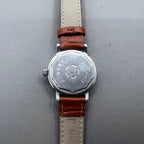 Light brown Shanghai manual mechanical watch with single calendar, 17 jewels, shock-resistant design for durability.