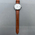 Light brown Shanghai manual mechanical watch with single calendar, 17 jewels, shock-resistant design for durability.