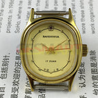 Shanghai Manual Mechanical Lady Watch with golden nails, yellow oval dial, 17 jewels, elegant design.