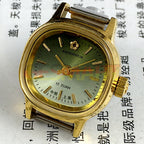 Shanghai Manual Mechanical Lady Watch with green dial, golden nail markers, 17 jewels, and square case for elegant style.