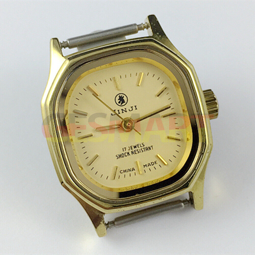 Elegant 26mm SHANGHAI JINJI lady watch with golden square case and 17 jewel manual mechanical movement.
