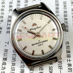 HONGLIAN manual mechanical watch with silver nail markers, round silver case, and sleek silver dial.