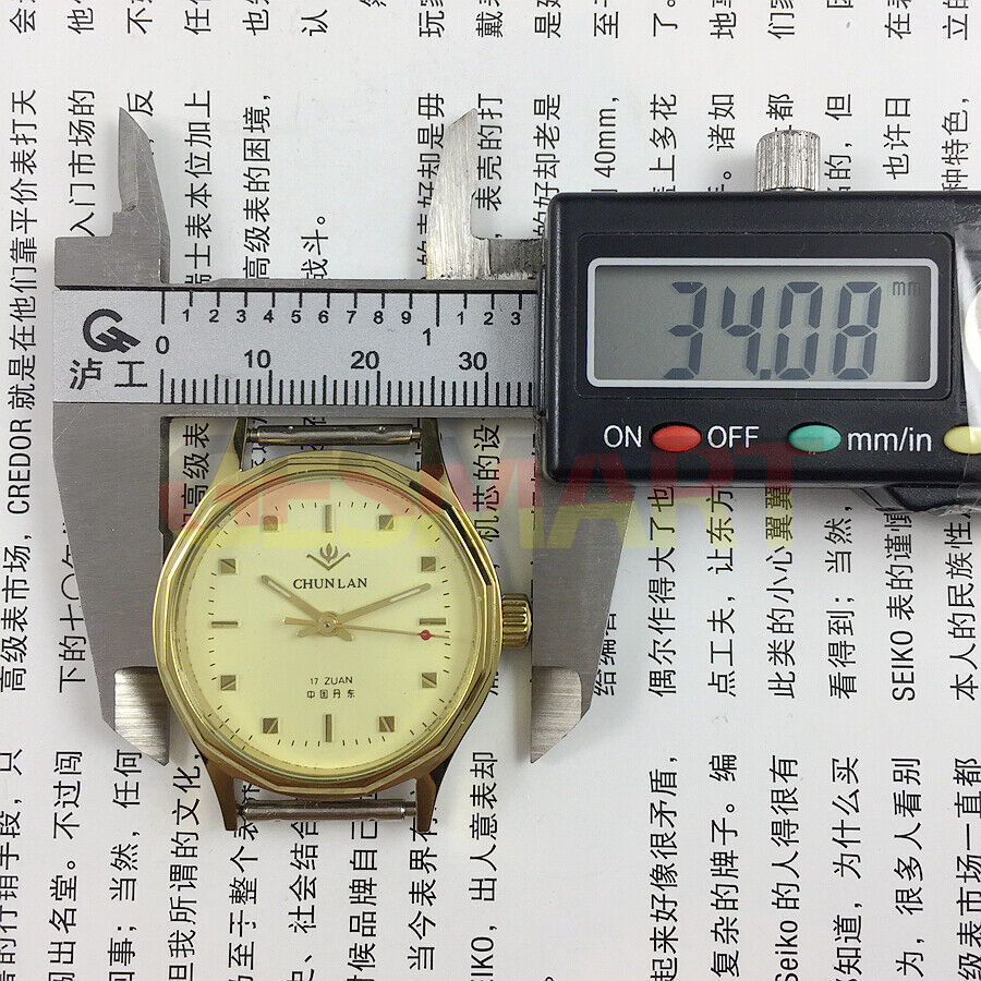 32mm manual mechanical watch featuring yellow dial and green lume hands with 17 jewels.