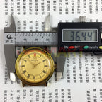 Tianjin Seagull 35mm round gold watch with manual mechanical movement and elegant gold dial for classic style.