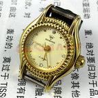 SHANGHAI DIAMOND manual mechanical lady watch with yellow dial and golden nail markers, elegant design.
