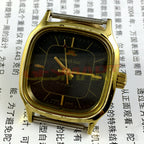HONGLIAN 34mm manual mechanical watch with black dial, gold nail markers, and square gold case for stylish wristwear.