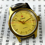 China Liaocheng TAISHAN manual mechanical lady watch with 19 jewels and golden nail accents, showcasing elegant craftsmanship and precise timekeeping.