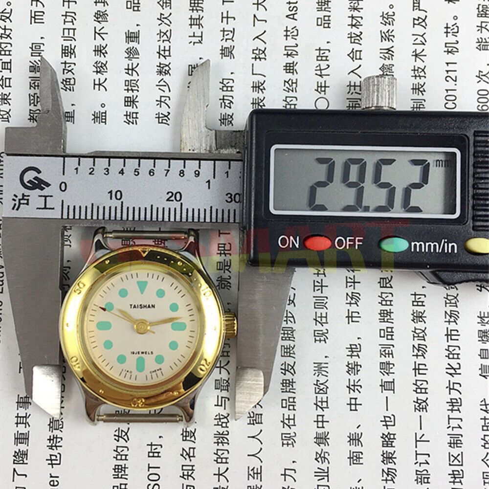 TAISHAN elegant 28mm manual mechanical lady watch with 19 jewels and golden numeric dial.