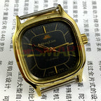 HONGLIAN 34mm manual mechanical watch with black dial and golden nail markers in a square golden case.