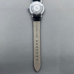 37mm China manual mechanical watch with black strap, silver dial, 19 jewels, shock-resistant design.