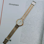 Reloj de cuarzo vintage unisex con brazalete metálico bicolor y movimiento importado NOS