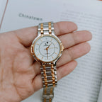 Reloj de cuarzo vintage unisex con brazalete metálico bicolor y movimiento importado NOS