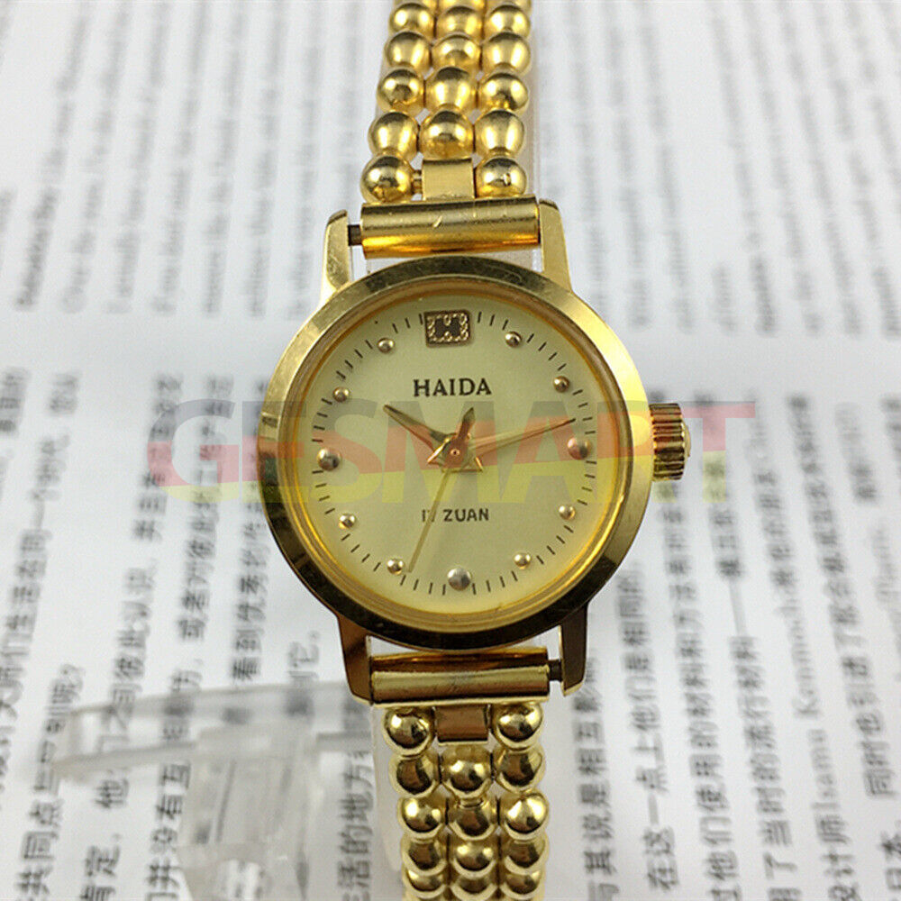 Shanghai brand lady manual mechanical watch with 17 jewels and golden nail design, 22mm case size.