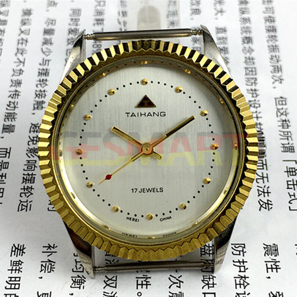 TAIHANG 38mm manual mechanical watch with silver dial, round case, 3 hands, and 17 jewels for accurate timekeeping.
