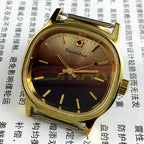 Shanghai Manual Mechanical Watch with golden nail markers, square case, gradient brown dial, perfect for elegant occasions.