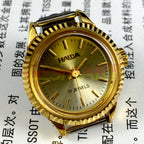 Elegant 24mm Shanghai Haida lady watch with golden nail markers, 17 jewels, and manual mechanical movement.
