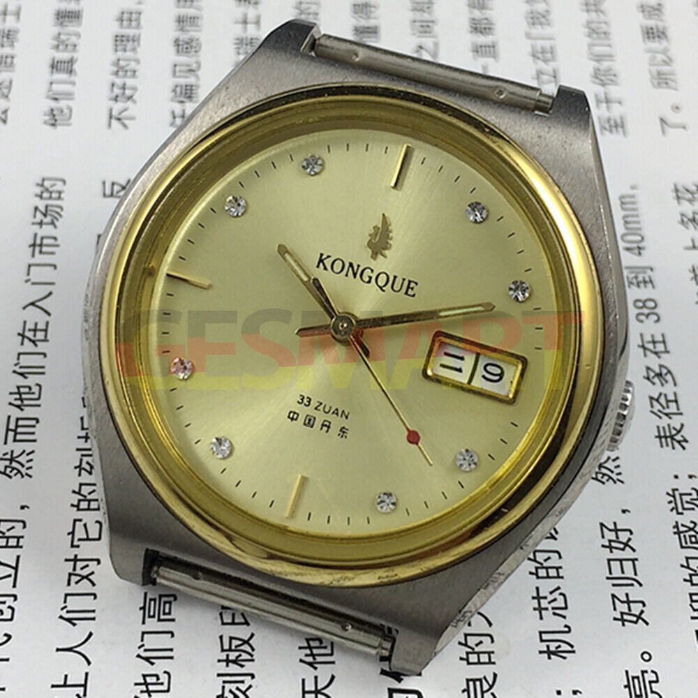 38mm China Made automatic watch with 17 jewels, double calendar, and golden dial.