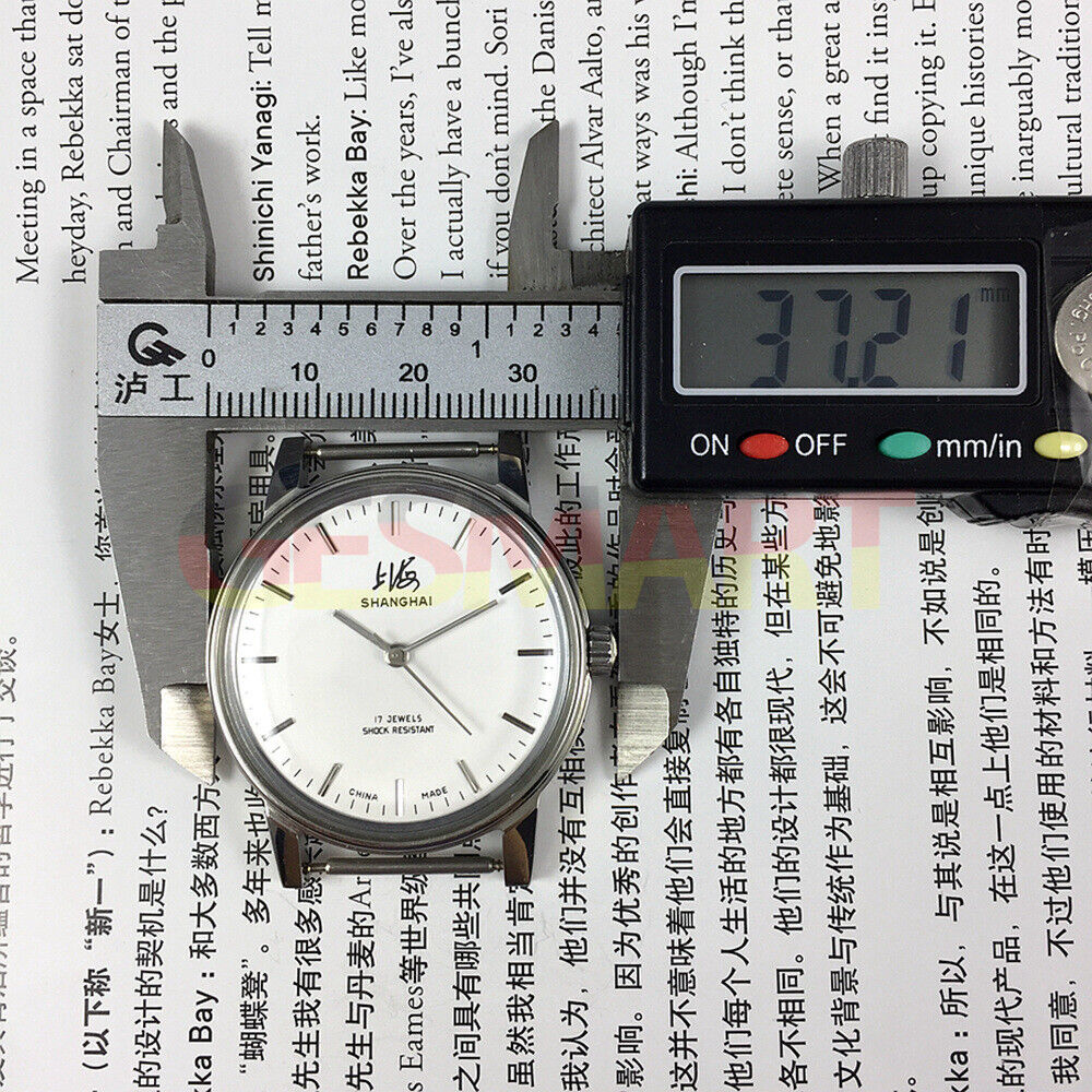 Shanghai 36mm manual mechanical watch 8120 with white dial, 17 jewels, classic Chinese craftsmanship by Shanghai brand.