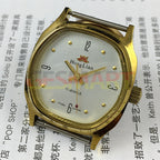 33mm HONGLIAN manual watch with gold numeral markers and square case, elegant timepiece accessory.