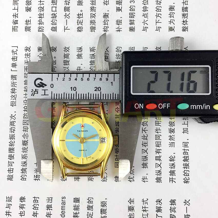 TAISHAN 26mm lady watch with gold case, manual mechanical movement, 19 jewels, and single calendar display.