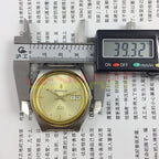 38mm automatic watch with golden dial, 17 jewels, and double calendar for stylish timekeeping.