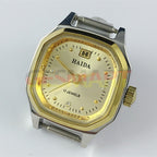 HAIDA Manual mechanical lady watch with golden nail accents, 17 jewels, and octagonal shaped case.