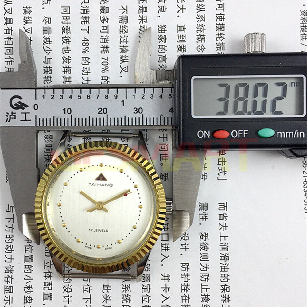 TAIHANG 38mm manual mechanical watch with silver dial, round case, and 17-jewel precision movement.