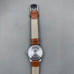 HONGLIAN 32mm brown leather band manual watch with 17 jewels and Roman numeral dial.
