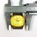 HONGLIAN 34mm manual mechanical watch with golden square case, nail markers, and elegant 3-hand design.