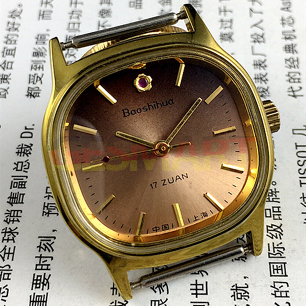 33mm Shanghai manual watch with golden nail markers, square case, and 17-jewel movement on brown dial.