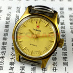 China Liaocheng TAISHAN manual mechanical lady watch with 19 jewels and golden nail accents, showcasing classic elegance and precise craftsmanship.
